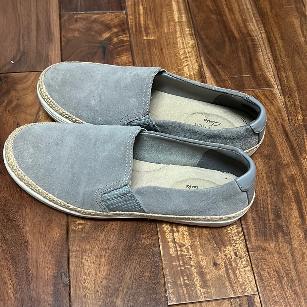 Women’s casual slip-on Clark’s shoes. Super cute and comfy.